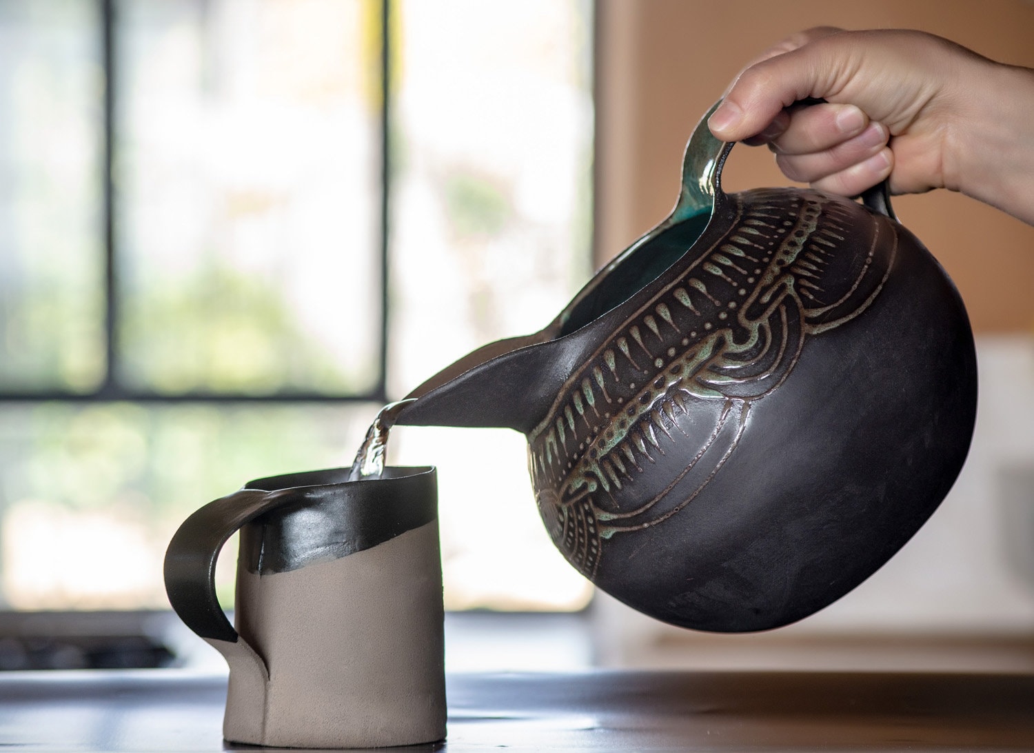 Black Ceramic Pitcher: Hand-Engraved Turquoise Glaze